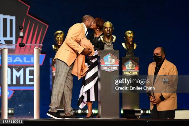 Charles Woodson shares a moment with his mother Georgia Woodson after unveiling his bust during the NFL Hall of Fame Enshrinement Ceremony at Tom...