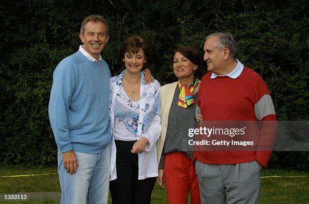 British Prime Minister Tony Blair and his French counterpart Jean-Pierre Raffarin are shown with wives Anne-Marie Raffarin and Cherie Blair at La...