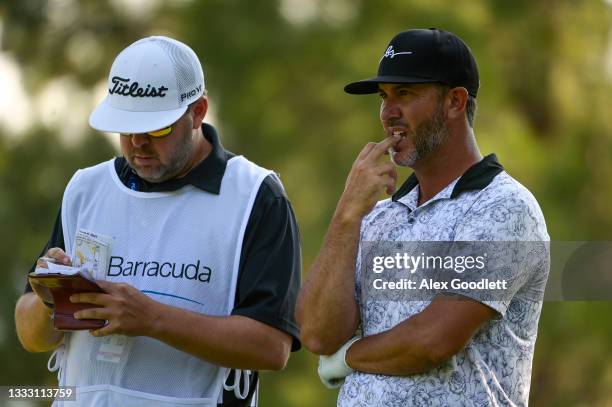 Scott Piercy of the United States waits on the 16th tee with his caddie during the final round of the Barracuda Championship at Tahoe Mountain Club's...