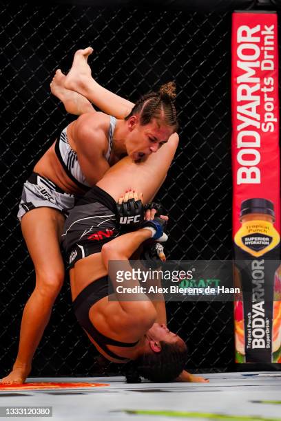 Karolina Kowalkiewicz drops Jessica Penne on her head during their Strawweight fight at Toyota Center on July 7, 2021 in Houston, Texas.