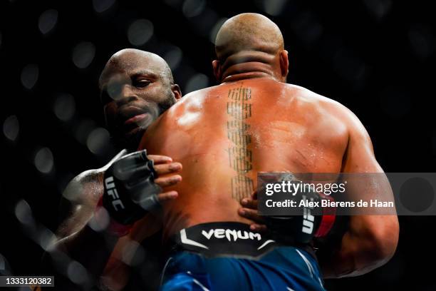 Derrick Lewis and Ciryl Gane grapple during their Heavyweight bout at Toyota Center on July 7, 2021 in Houston, Texas.