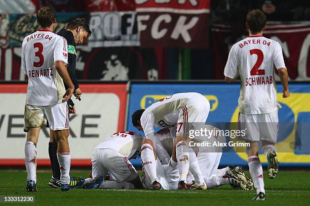 Michael Ballack of Leverkusen celebrates his team's first goal with team mates during the Bundesliga match between 1. FC Kaiserslautern and Bayer 04...