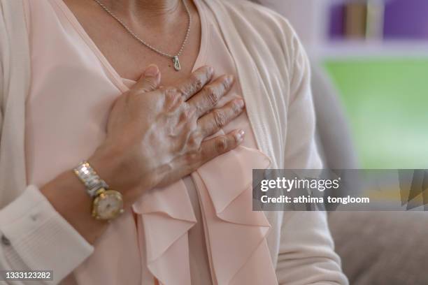 older women with chest pain. - blodpropp bildbanksfoton och bilder