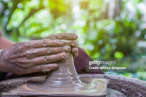 pottery.hands working on pottery wheel. - pottery wheel stock pictures, royalty-free photos & images