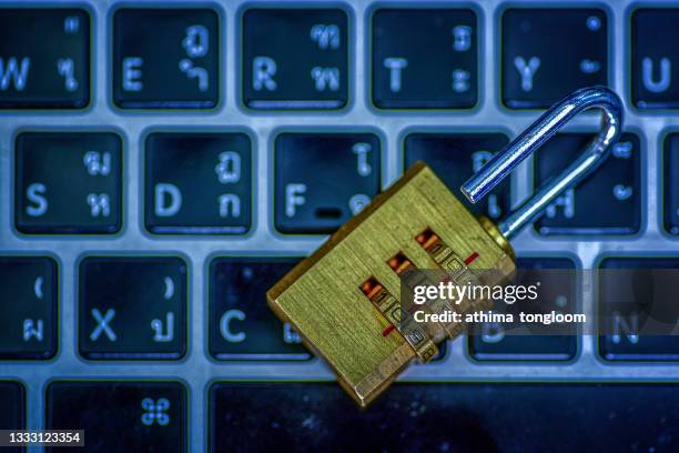 computer security concept. padlock on computer circuit board - antivirus software bildbanksfoton och bilder