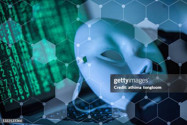 hacker wear an anonymous mask. - activist stockfoto's en -beelden