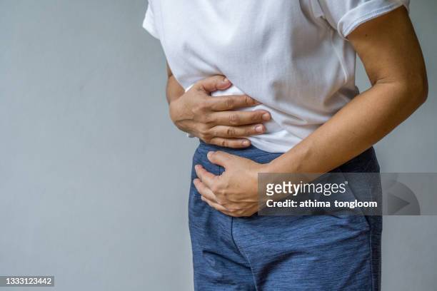 woman having painful stomachache. - sistema digestivo imagens e fotografias de stock