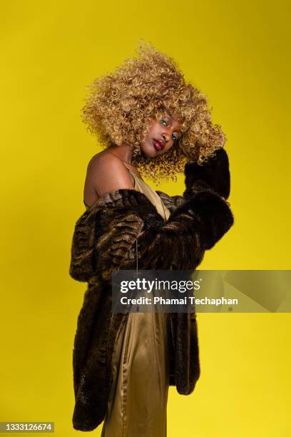 woman in fur coat - fur dress stock pictures, royalty-free photos & images