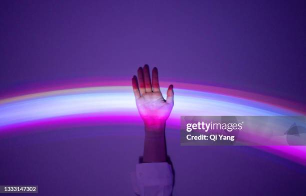 touching the rainbow - technology or innovation imagens e fotografias de stock