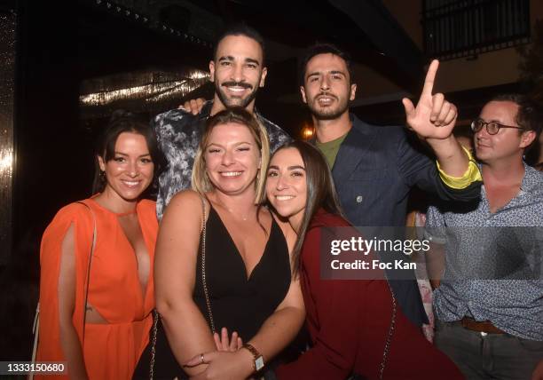 Football player Adil Rami poses with fans during the "Sunday Vibes" Guy Gerber DJ Set at VIP Room In Saint-Tropez on August 8, 2021 in Saint Tropez,...