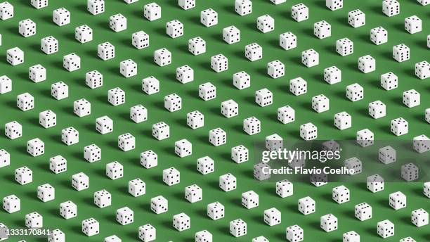 white dices on green surface pattern background - brettspiel würfel stock-fotos und bilder