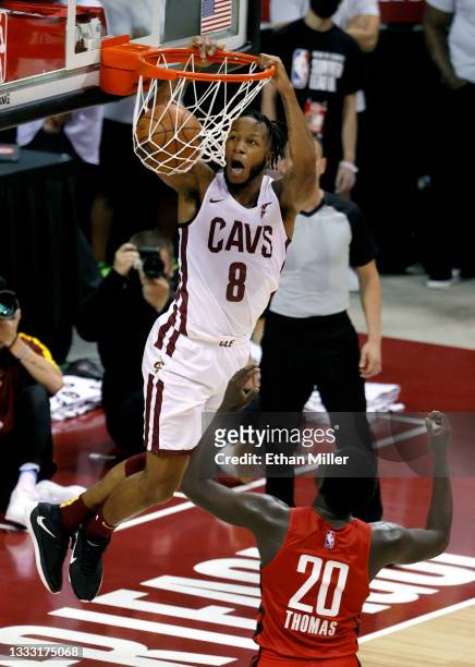Lamar Stevens of the Cleveland Cavaliers dunks in front of Khyri Thomas of the Houston Rockets during the 2021 NBA Summer League at the Thomas & Mack...