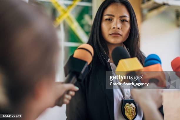 female police chief talking to reporters - police press conference stock pictures, royalty-free photos & images