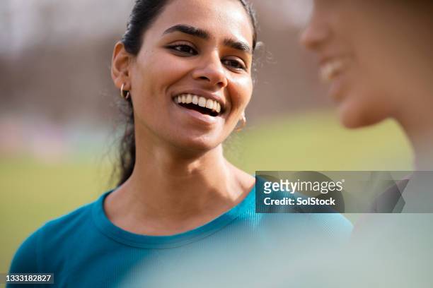happiest after a work out - chatting park stockfoto's en -beelden