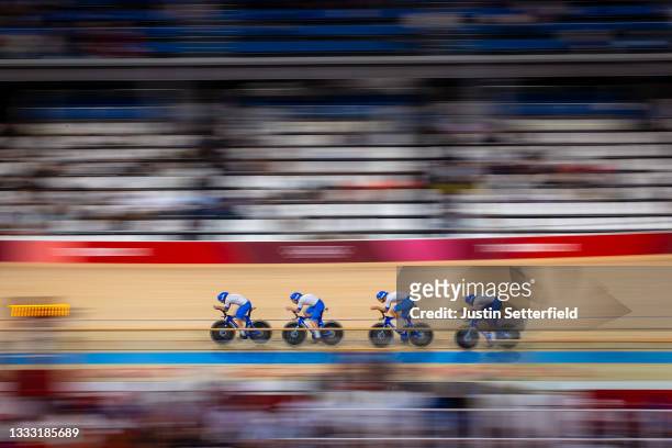 Francesco Lamon, Simone Consonni of Team Italy and teammates sprint to setting a new Olympic record during the Men´s team pursuit first round, heat 3...