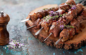Shish kebab, Grilled lamb meat skewers with spices and oregano flowers