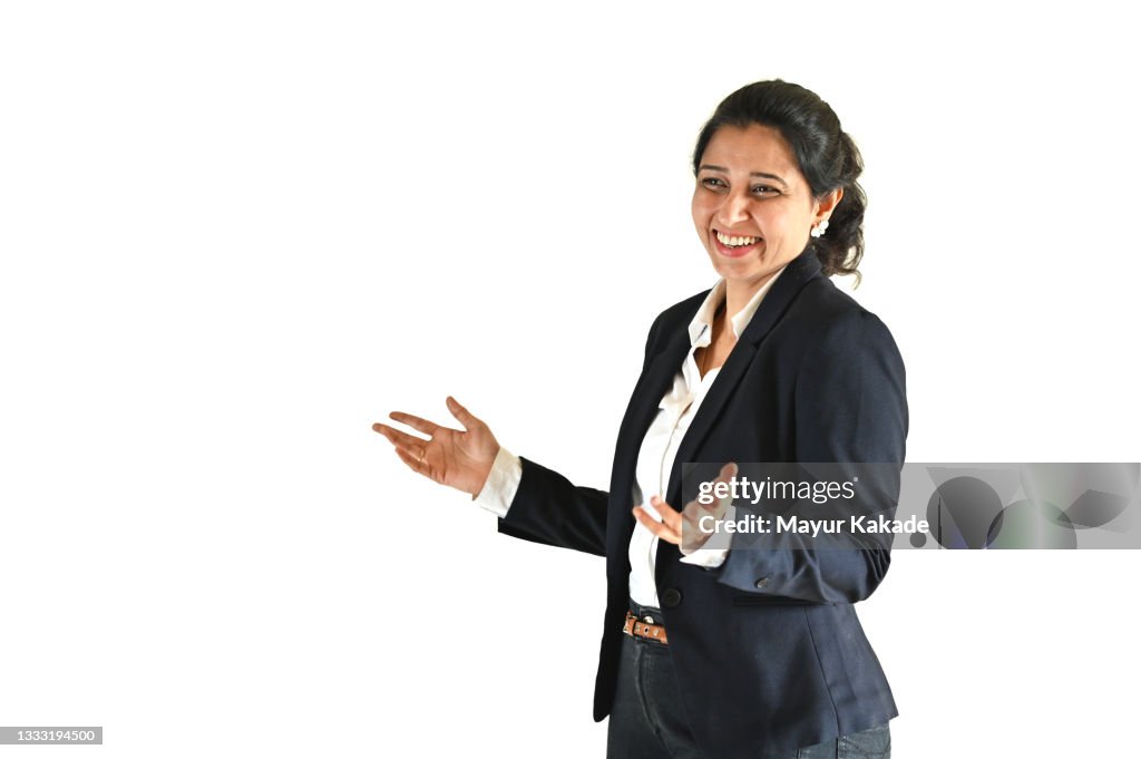 Portrait of a mid age woman smiling and talking against white background