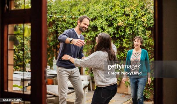 couple welcoming guests for party - greeting guests stock pictures, royalty-free photos & images