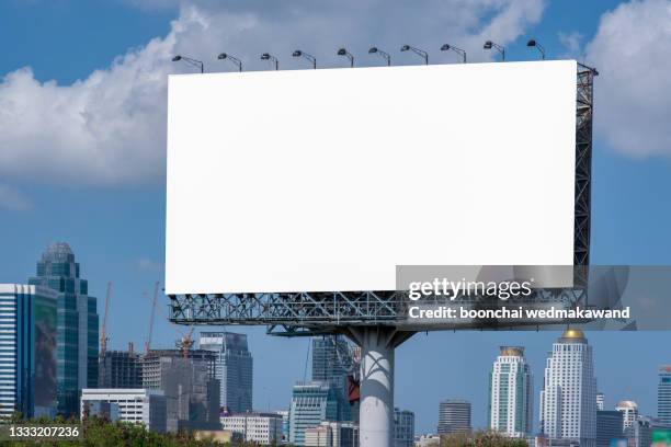 road with lanterns and large blank billboard at evening in city : bangkok : thailand - street light banner stock pictures, royalty-free photos & images