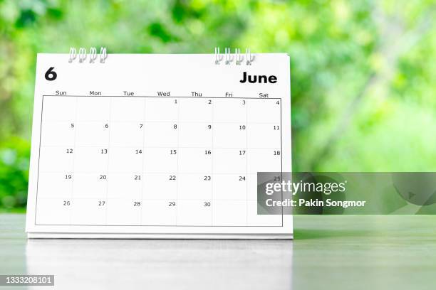 calendar desk 2022 june month for organizer to plan and reminder on wooden table with nature background. - june 1 stock pictures, royalty-free photos & images