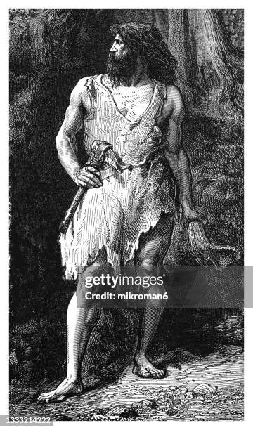 old engraved illustration of prehistoric man - steinzeit stock-fotos und bilder