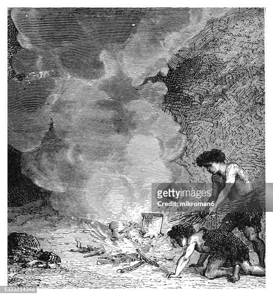 old engraved illustration of manners of prehistoric peoples - people lighting a fire - cave fire 個照片及圖片檔