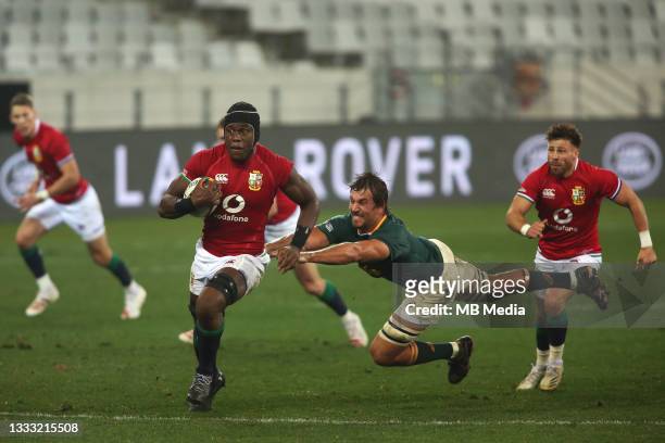 Maro Itoje of the British & Irish Lions on the attack as Eben Etzebeth of South Africa fails to make the tackle during the 3rd Test between South...