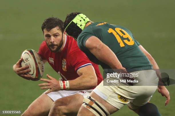 Robbie Henshaw of the British & Irish Lions attempts to get past Marco van Staden of South Africa during the 3rd Test between South Africa and the...