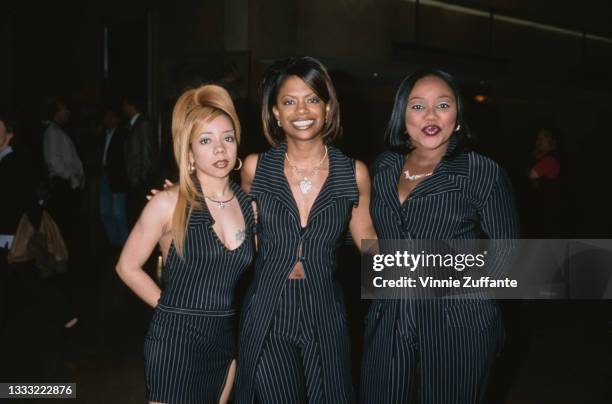 American R&B group Xscape , each wearing a black pinstripe outfit, attend the 1998 ASCAP Pop Music Awards in Beverly Hills, California, 18th May...