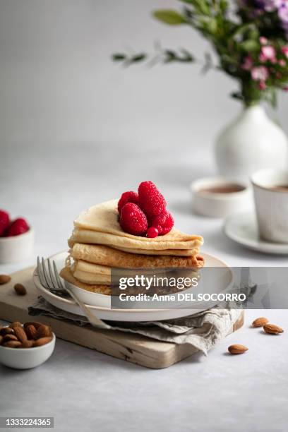 pile of pancakes with yogurt raspberries - brambleberry stock pictures, royalty-free photos & images