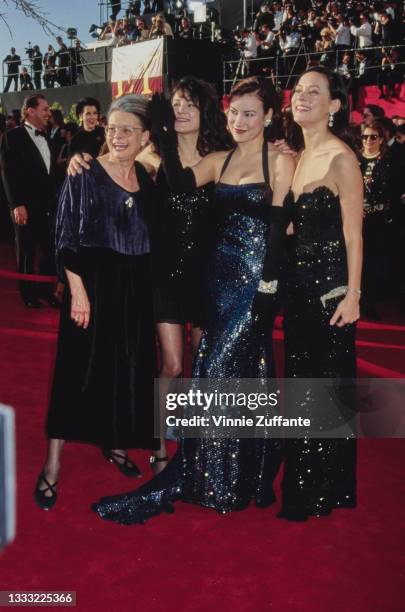 Patricia Tilly with her daughters, American-Canadian actress Meg Tilly, American-Canadian actress Jennifer Tilly, wearing a full-length halterneck...