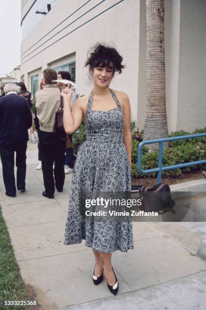 American-Canadian actress Jennifer Tilly, wearing a grey-and-white halterneck dress, attends the 7th Annual IFP/West Independent Spirit Awards, held...