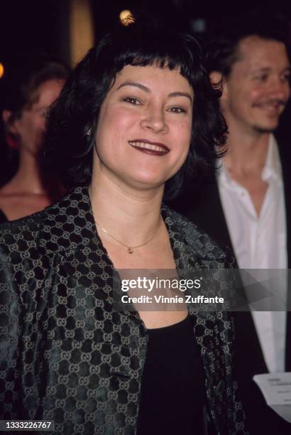 American-Canadian actress Jennifer Tilly, wearing a grey-and-black jacket, attends the premiere of 'US Marshalls' held at the Mann Village Theater in...