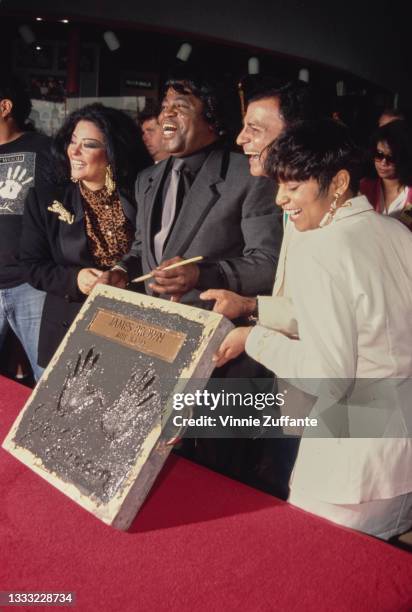 Adrienne Rodriguez and her husband, American singer, songwriter and musician James Brown , and his daughter, Yamma Brown, during his ceremony at...