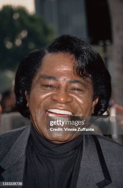 American singer, songwriter and musician James Brown attends his Hollywood Walk Of Fame ceremony in Los Angeles, California, 11th January 1997.