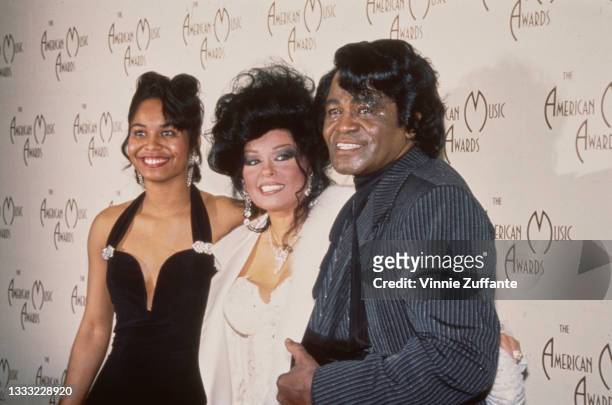 American singer, songwriter and musician James Brown with his wife, Adrienne Rodriguez, and daughter, Deanna Brown Thomas, in the 1992 American Music...