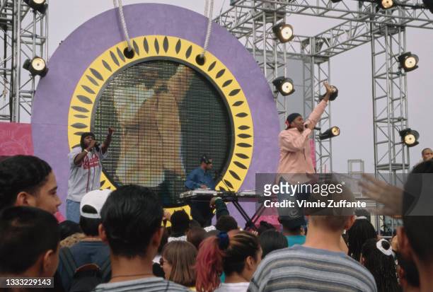 American rapper Phife Dawg and American rapper Q-Tip on stage as their band, A Tribe Called Quest, perform at the 1996 Nickelodeon Big Help at Santa...