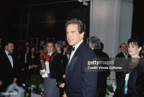 American actor Warren Beatty, wearing a tuxedo, attends the 62nd Annual Academy Awards, held at the Dorothy Chandler Pavilion in Los Angeles,...