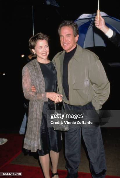 American actress Annette Bening and her husband, American actor Warren Beatty attend the Beverly Hills premiere of 'Bulworth' Beverly Hills Premiere,...