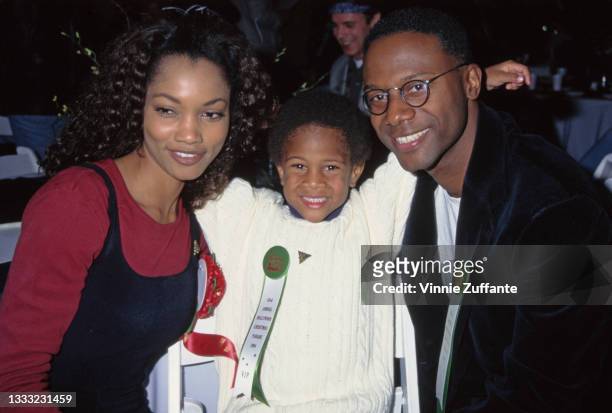 Haitian-born American actress and fashion model Garcelle Beauvais with her son, Oliver Saunders, and her husband, producer Daniel Saunders, attend...