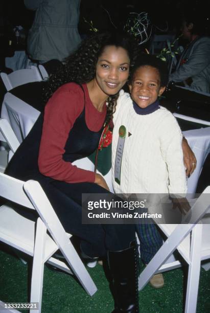 Haitian-born American actress and fashion model Garcelle Beauvais and her son, Oliver Saunders, attend the 63rd Annual Hollywood Christmas Parade in...