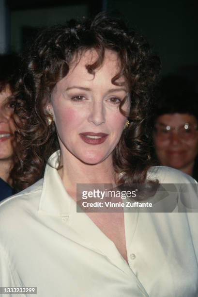 American actress Bonnie Bedelia wearing a cream blouse, attends an unspecified event, location unspecified, 1994.