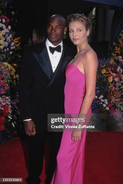 American model and actor Tyson Beckford and American model Bridget Hall attend the 68th Annual Academy Awards, held at the Dorothy Chandler Pavilion...