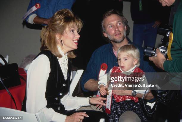 American broadcaster Leeza Gibbons with her husband American actor Stephen Meadows, and son Troy Meadows attend the 62nd Annual Hollywood Christmas...