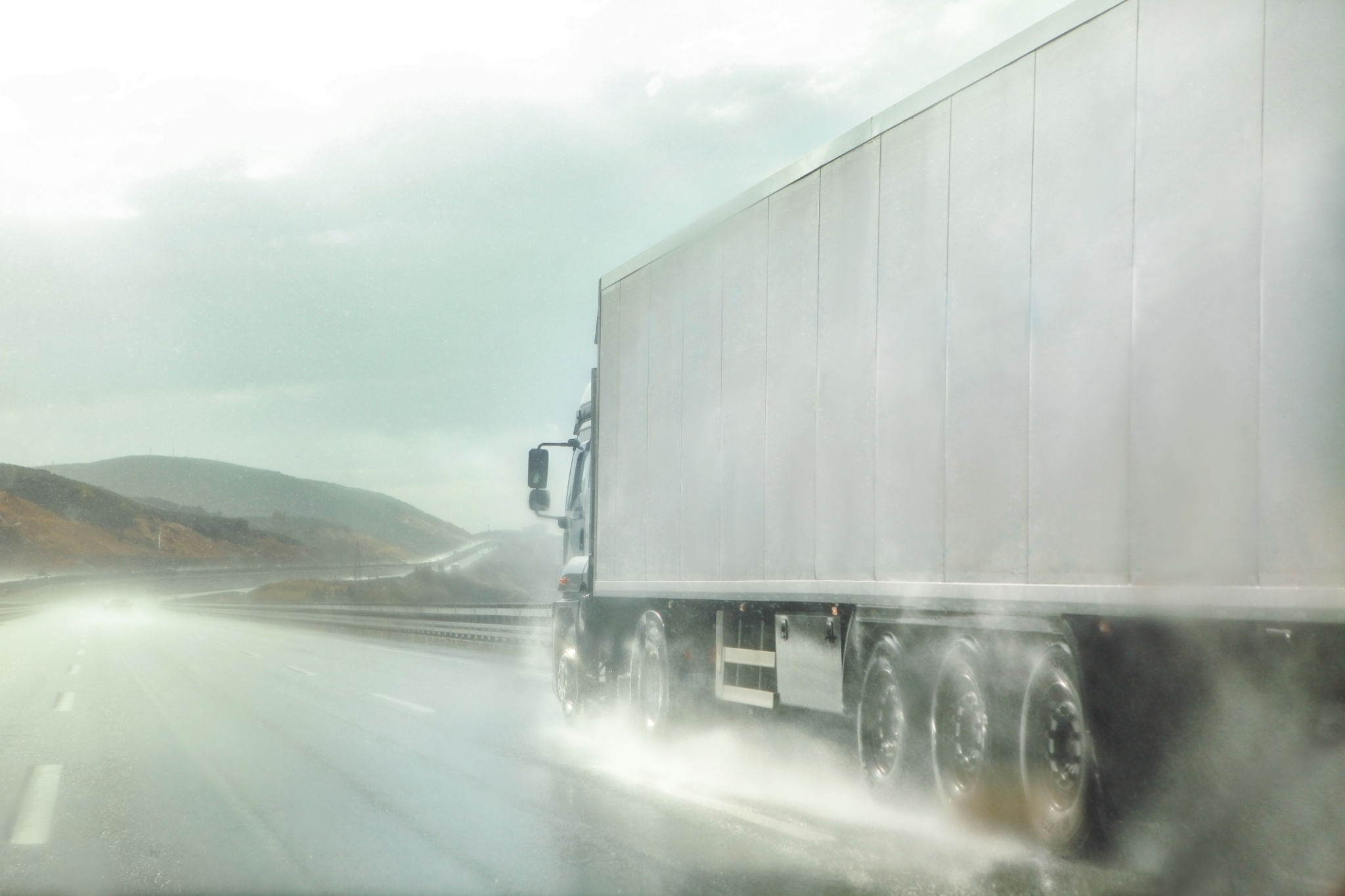 truck driving through rain