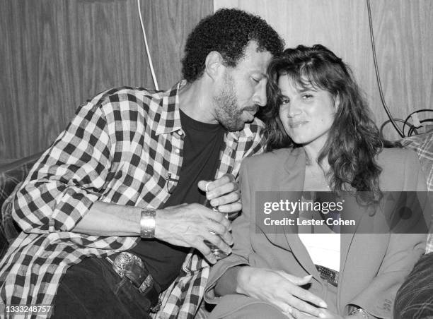 American singer, songwriter, musician, and television personality Lionel Richie and girlfriend Diane Alexander pose for a portrait circa July, 1993...