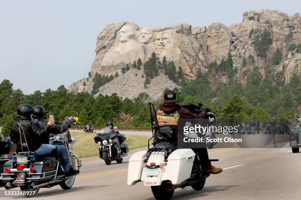 Bikers ride along the road to Mt. Rushmore on August 09, 2021 near Keystone, South Dakota. Every August hundreds of thousands of motorcycling...
