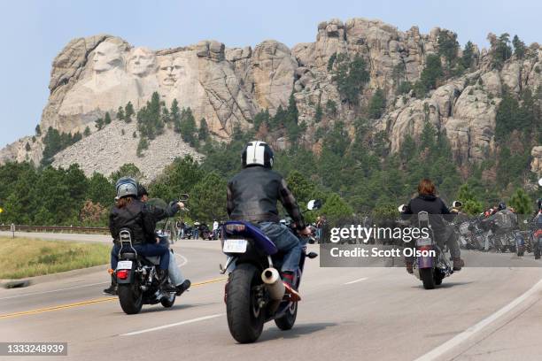 Bikers ride along the road to Mt. Rushmore on August 09, 2021 near Keystone, South Dakota. Every August hundreds of thousands of motorcycling...