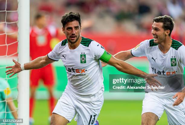 Lars Stindl of Borussia Moenchengladbach celebrates the first goal for his team with Florian Neuhaus of Borussia Moenchengladbach during the DFB Cup...