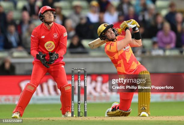 Liam Livingstone of Birmingham Phoenix hits out watched by Tom Banton of Welsh Fire during The Hundred match between Birmingham Phoenix Men and Welsh...